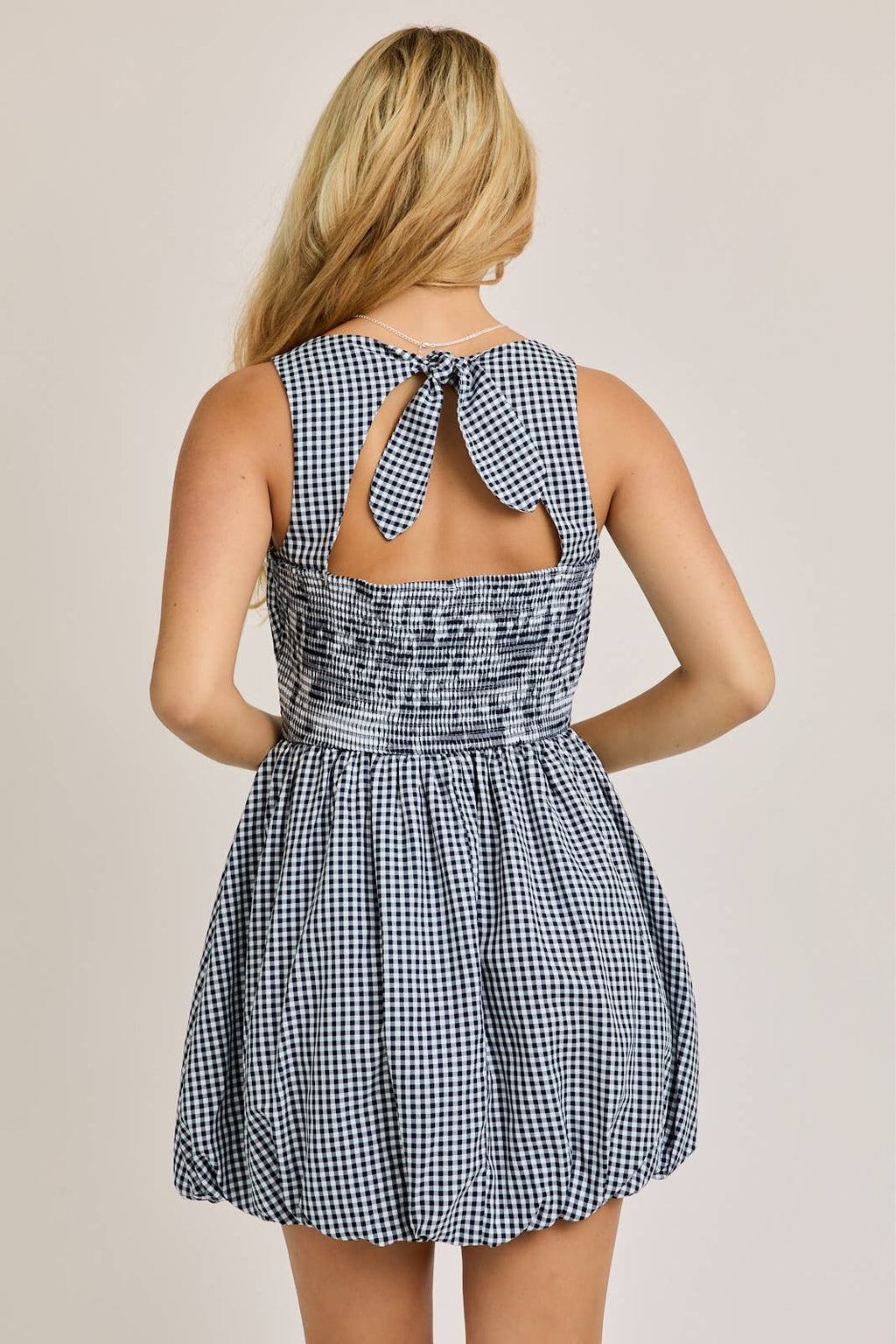 BOAT NECK SLEEVELESS BUBBLE HEM DRESS: NAVY - Rose & Olivia Boutique