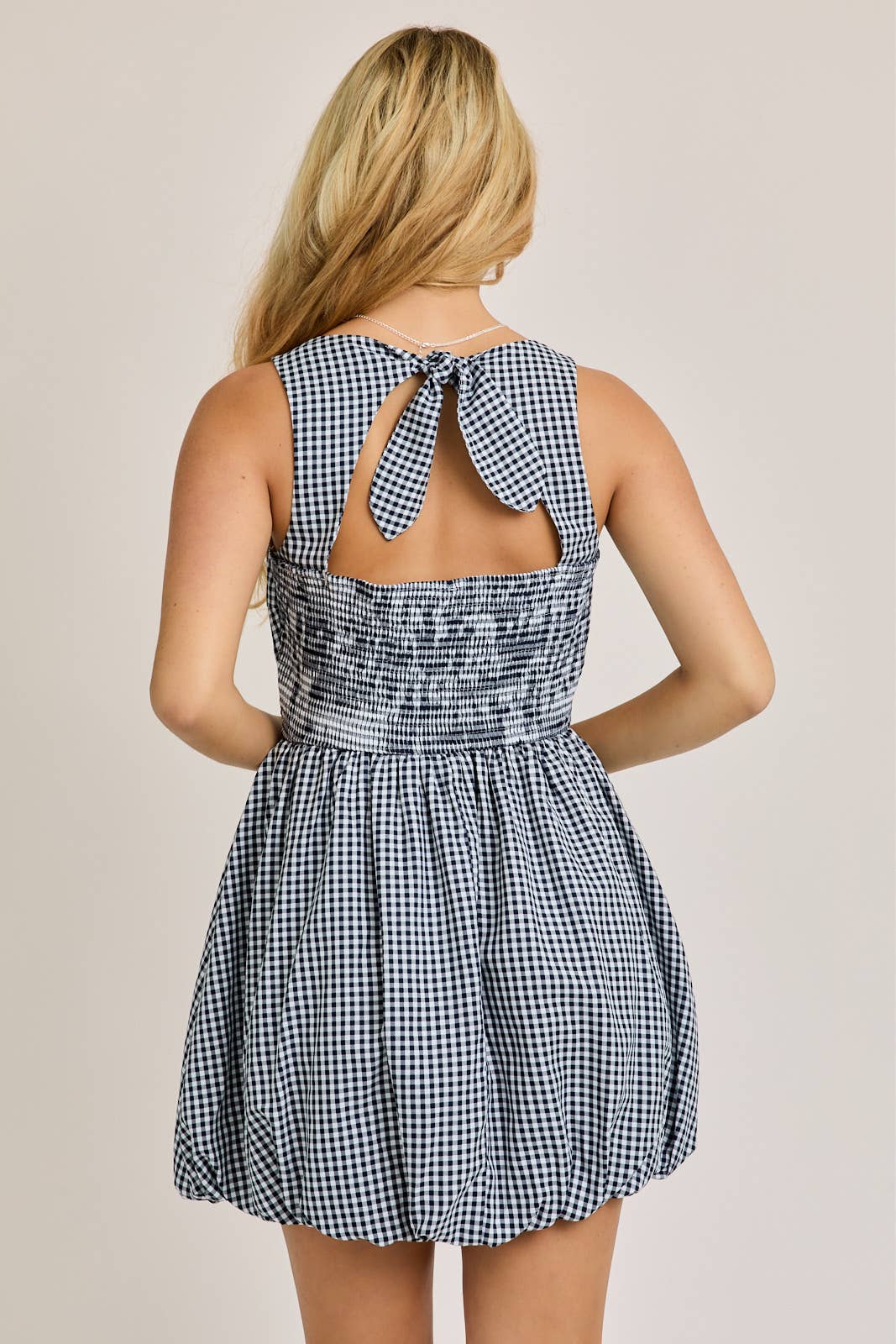BOAT NECK SLEEVELESS BUBBLE HEM DRESS: NAVY - Rose & Olivia Boutique